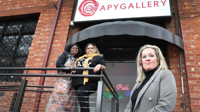 APYACC general manager Skye O’Meara, right, with artist, Rhoda Tjitayi, left, and Sally Scales. Picture: Dean Martin