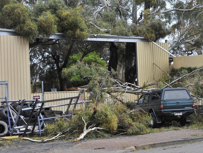 Roofs and parts of buildings were ripped off as the weather system attacked. Picture: David Mariuz