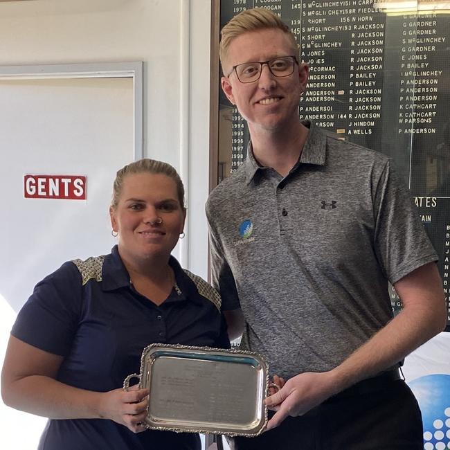 Central Queensland golfer Shai Pearce receives her trophy from Golf Australia events manager Aaron Goggin after her win in Boulia in 2021.