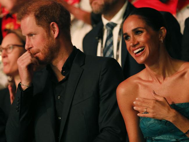 Prince Harry took to the stage for his speech without Ms Markle. Picture: AFP<br/>