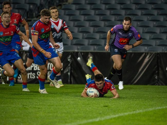 Taj Blackman scores for Newcastle in the SG Ball Cup. Picture: Thomas Lisson