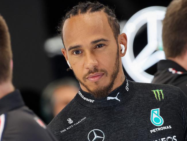 Mercedes' British driver Lewis Hamilton (C) looks on during the third practice session ahead of the 2023 Saudi Arabia Formula One Grand Prix at the Jeddah Corniche Circuit in Jeddah on March 18, 2023. (Photo by Giuseppe CACACE / AFP)