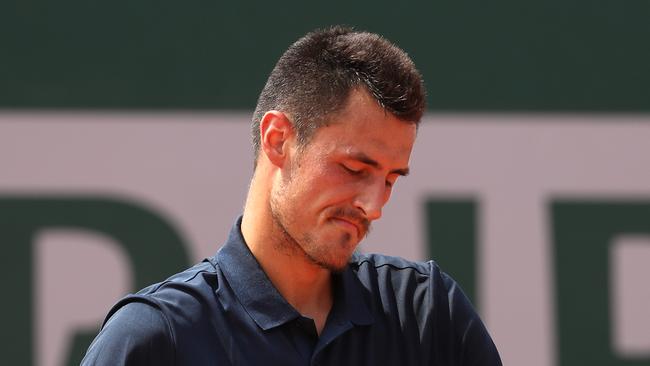 Bernard Tomic was bundled out of the French Open by Argentinian Marco Trungelliti.