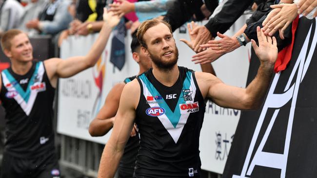 Port Adelaide players celebrate their win in China. Picture: AAP Images