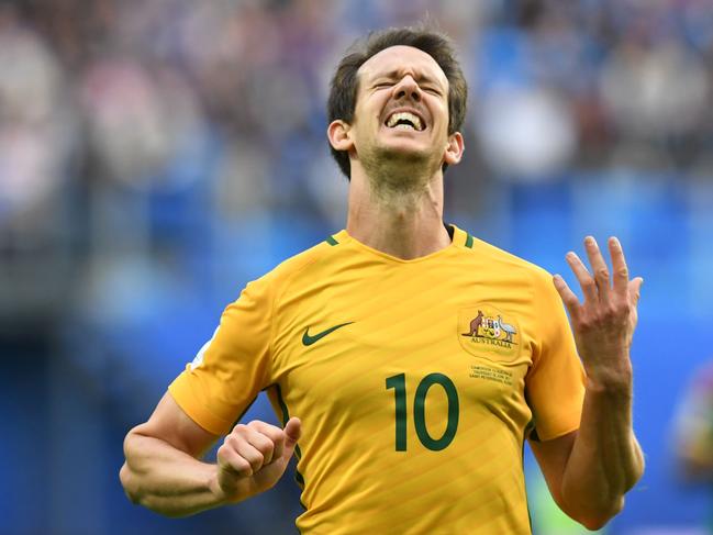 Australia's midfielder Mark Milligan celebrates after scoring with a penalty during the 2017 Confederations Cup group B football match between Cameroon and Australia at the Saint Petersburg Stadium on June 22, 2017. / AFP PHOTO / Kirill KUDRYAVTSEV