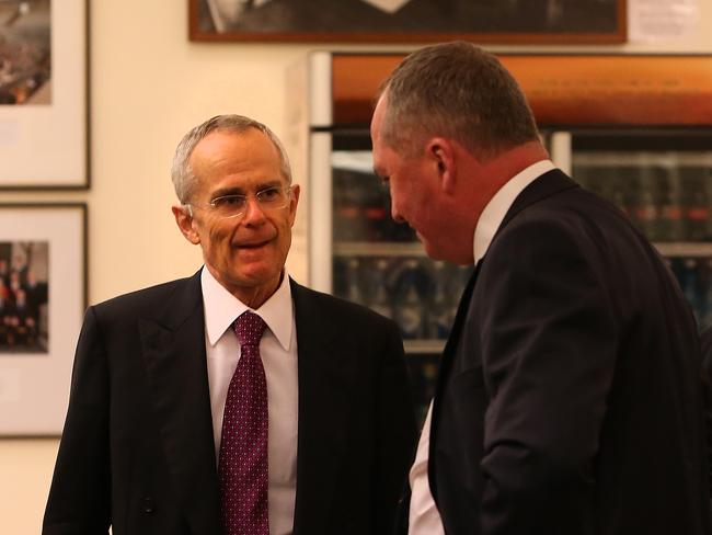 ACCC Chairman Rod Sims speaking with Barnaby Joyce before addressing the National's Party Room Meeting at Parliament House in Canberra. Picture Kym Smith