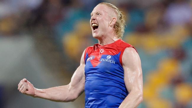 BRISBANE, AUSTRALIA - MARCH 24: Clayton Oliver of the Demons celebrates a goal during the 2023 AFL Round 02 match between the Brisbane Lions and the Melbourne Demons at the Gabba on March 24, 2023 in Brisbane, Australia. (Photo by Russell Freeman/AFL Photos via Getty Images)