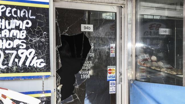 Broken glass at the Jetty Rd shop. Photo Mike Burton/AAP.