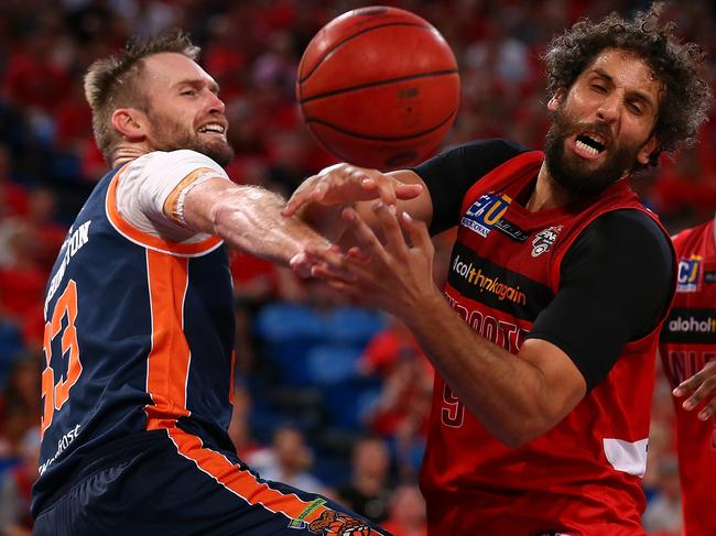 Former Wildcat Matt Knight contests for a loose ball during the game two NBL Semi Final match between Perth and the Cairns Taipans in 2017. Photo: Paul Kane/Getty Images.