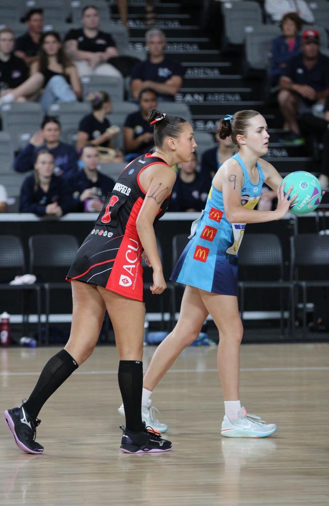 Gold Coast Titans v Brisbane North Cougars U16 Nissan State Titles grand final. Pictured: Morgan Smith (blue) and Arianna Ransfield (red)