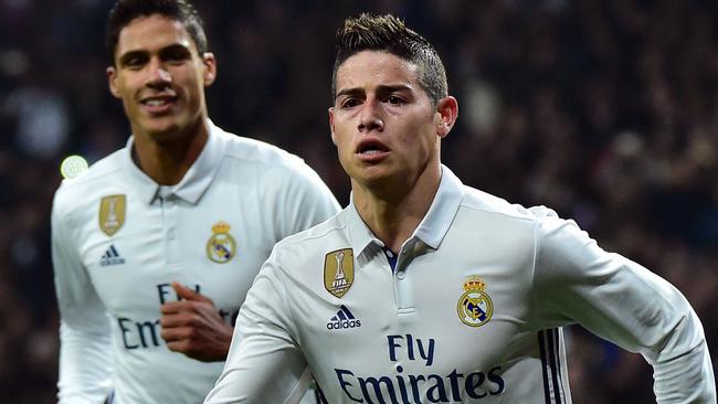 Real Madrid's Colombian midfielder James Rodriguez (R)