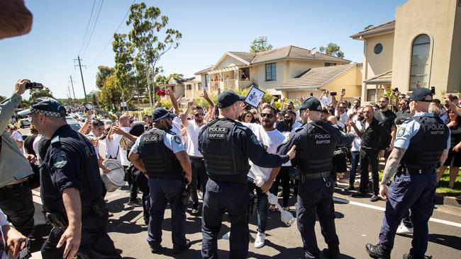 Police officers kept an eye on the chanting crowd.