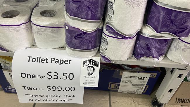 A sign for toilet paper prices is seen at a Redfern Convenience Store in Sydney, Tuesday, March 24, 2020. The store is combating coronavirus toilet paper hoarders by slugging them $99 for two packs. Picture: AAP Image/Callum Godde)