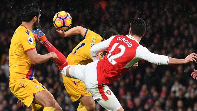 Olivier Giroud of Arsenal scores the opening goal.