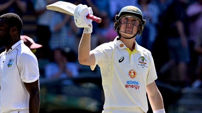 Marnus Labuschagne (R) celebrates scoring 150 runs against the West Indies at the Adelaide Oval in Adelaide on December 9, 2022. (Photo by William WEST / AFP) / -- IMAGE RESTRICTED TO EDITORIAL USE - STRICTLY NO COMMERCIAL USE --