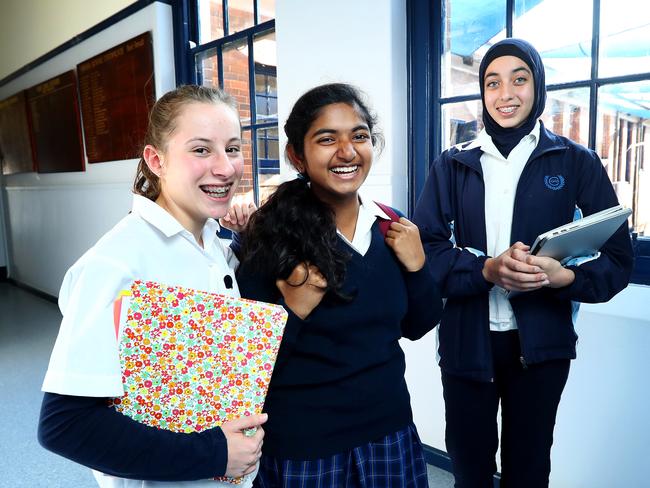 10/09/2018: Canterbury Girls High School students (L-R) Mieke Van Wel, 14, Shivani Kadiyala, 14, and Ayat Qabha, 14. According to an OECD study, girls are more motivated than boys to do well at school, while students born overseas are significantly more achievement-orientated than those born in Australia. The latest instalment of the Program for International Student Assessment (PISA), measuring achievement motivation of 15 year olds across the globe, has revealed that Australian students are more motivated than the OECD average, ranking eighth out of 35 OECD countries. Hollie Adams/The Australian