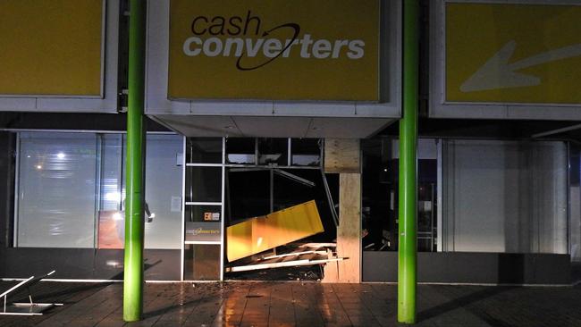 The entrance to the outlet had been boarded up from an earlier ram raid on Monday. Picture: Chelsea SES