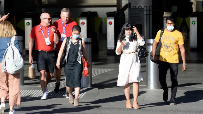 Morning commuters at Flinders Street on Thursday as Melbourne returns from the five-day lockdown. Picture: Andrew Henshaw