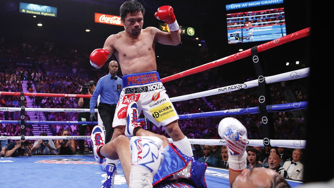 Manny Pacquiao, reacts after knocking down Keith Thurman in the first round.