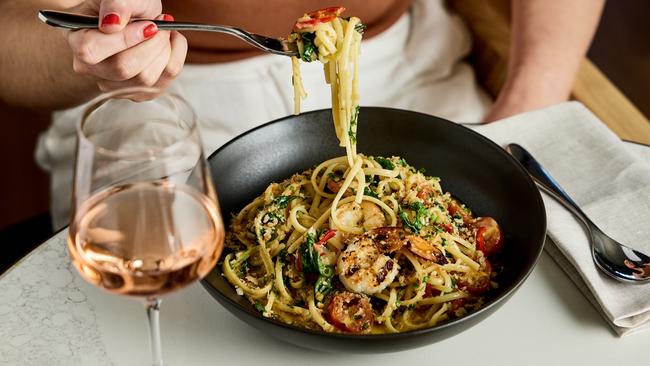 King prawn linguine, blistered tomatoes with wild rocket.