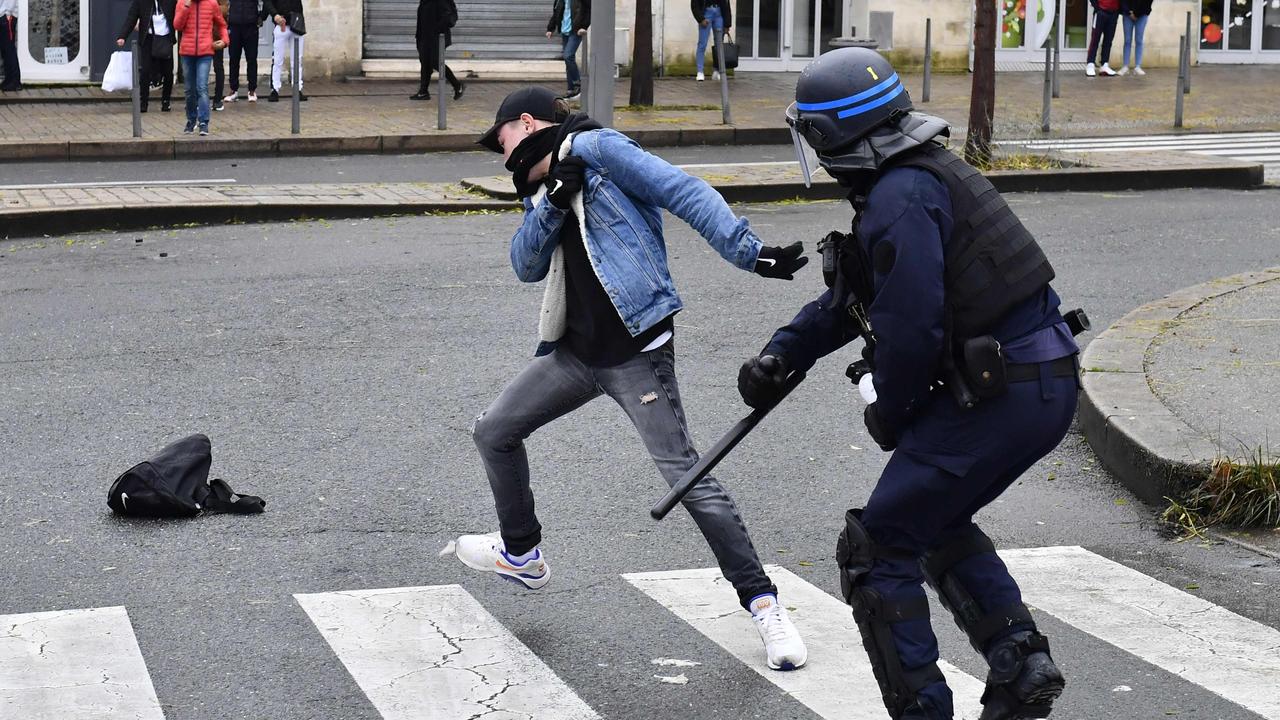 A high school student clashes with a riot police officer during a demonstration against French government Education reforms on December 3, 2018 in Bordeaux, southwestern France. Picture: AFP