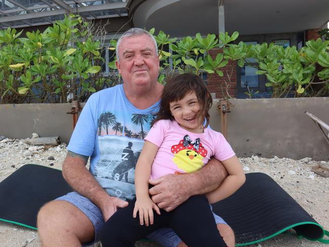 Phillip Burchett, 58, with his daughter Charli Mia, 4, in Jimbaran beach where he sometimes spent the night. Picture: Lukman S. Bintoro