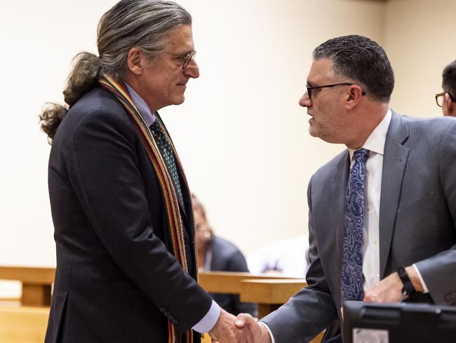 Norm Pattis, left, Fotis Dulos' lawyer, shakes hands with Stamford State's Attorney Richard Colangelo after they reached an agreement during a bond hearing on January 19. Picture: AP