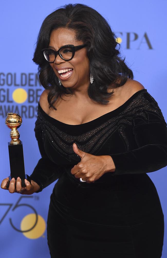 Oprah Winfrey poses in the press room with the Cecil B. DeMille Award at the 75th annual Golden Globe Awards, Picture: AP