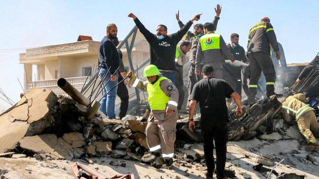 Lebanese civil defence members search the rubble in the aftermath of an Israeli airstrike on the village of Sarein, near Baalbek on Tuesday. Picture: AFP