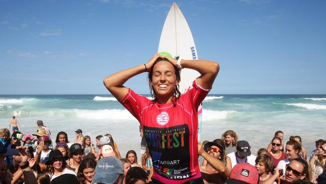 Australia's Sally Fitzgibbons celebrates her victory after defeating Australia's Stephanie Gilmore in the final of the Surfest 2016 surfing competition at Merewether Beach in Newcastle. Pic Brett Costello