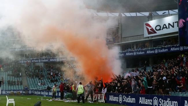 Wanderers fans light a flare during the Sydney FC v Western Sydney Wanderers A-League match at Allianz Stadium. Picture: Brett Costello