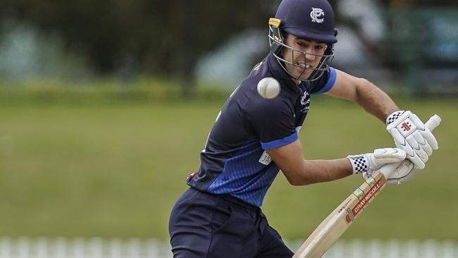 Vic Premier Cricket grand final. Prahran v Dandenong. Dandenong keeper Jacques Augustin and Prahran batsman Damon Egan. Picture: Valeriu Campan