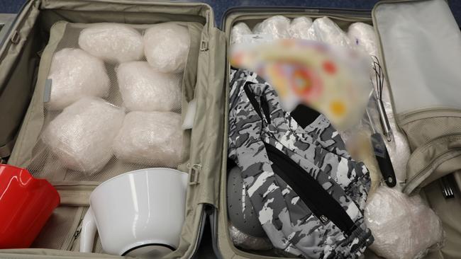 The man was stopped by Australian Border Force officers who located more than 20 plastic wrapped packages, with initial testing providing a presumptive positive for methamphetamine