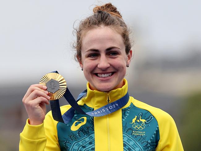 PARIS, FRANCE - JULY 27: Gold medalist Grace Brown of Team Australia poses on the podium during the Women's Individual Time Trial on day one of the Olympic Games Paris 2024 at Pont Alexandre III on July 27, 2024 in Paris, France. (Photo by Tim de Waele/Getty Images)