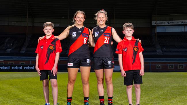 VFLW Players: Eloise Ashley-Cooper (#8) and Alex Morcom (#21) with Mitchell McCarthy (L) and Alex McCarthy (R) from Essendon Bowls Club Photographer: Daniel Pockett