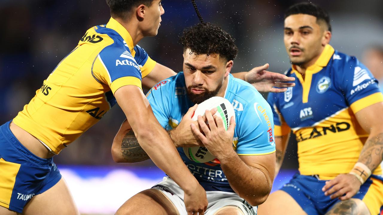 GOLD COAST, AUSTRALIA – JULY 13: Jojo Fifita of the Titans is tackled during the round 19 NRL match between Gold Coast Titans and Parramatta Eels at Cbus Super Stadium, on July 13, 2024, in Gold Coast, Australia. (Photo by Chris Hyde/Getty Images)