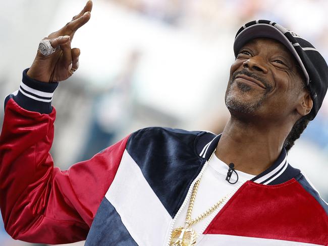 TOPSHOT - US rapper and sports commentator for US broadcaster NBC, Snoop Dogg gives the start of the Women's Breaking dance competition during the Paris 2024 Olympic Games at La Concorde in Paris, on August 9, 2024. (Photo by Odd ANDERSEN / AFP)