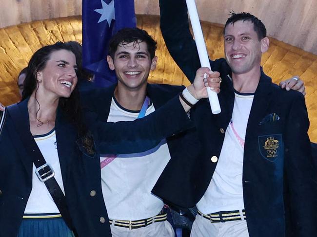 PARIS, FRANCE - JULY 26: Members of Team Australia react as they are seen on a boat on the River Seine during the opening ceremony of the Olympic Games Paris 2024 on July 26, 2024 in Paris, France. (Photo by Quinn Rooney / POOL / AFP)