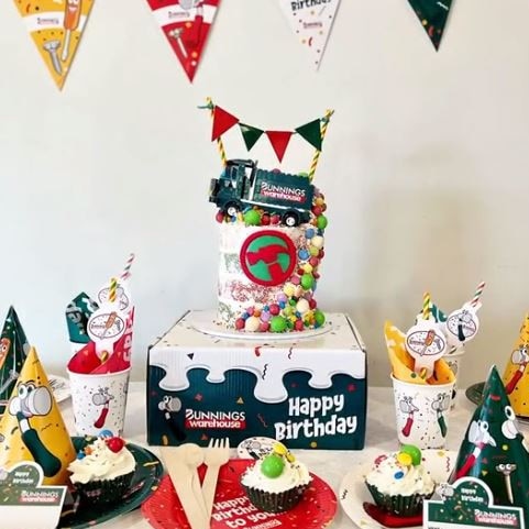 She used the Bunnings kids party pack decorations to complete the look, and used the box as a cake stand. Picture: TikTok/tigga_mac