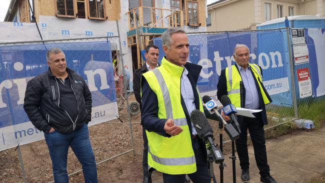 Metricon acting chief executive Peter Langfelder speaks about the state of the home building company alongside acting executive chairman Ross Palazzesi and suppliers on Thursday. Picture: Kiel Egging