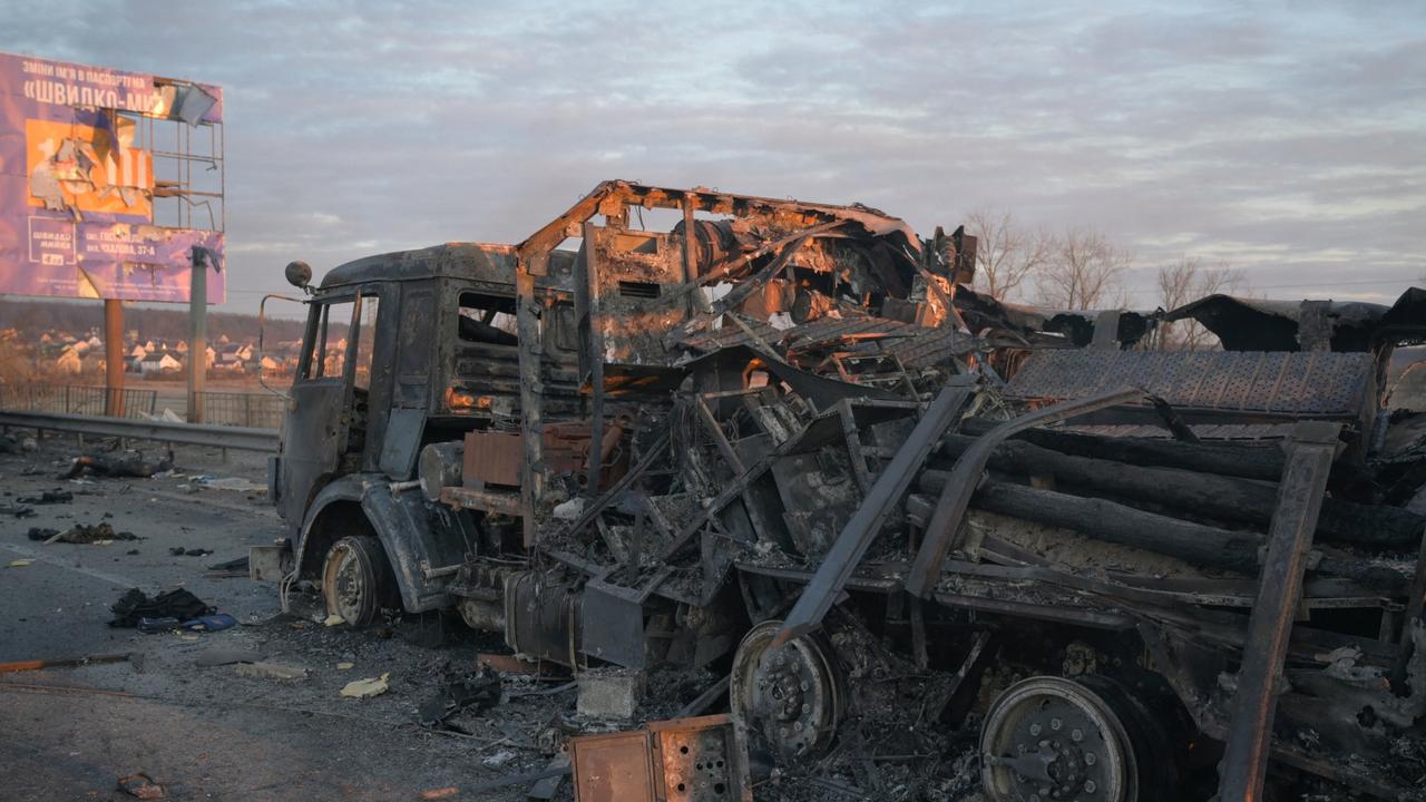 A charred military vehicle is seen on a road, as Russia's invasion of Ukraine continues, near the town of Bucha in the Kyiv region. Picture: Maksim Levin