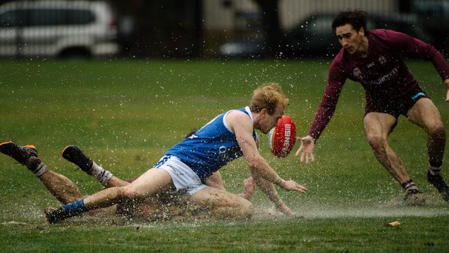 SPOC’s Nick McGill slides into the contest against PAOC. Picture: AAP/Morgan Sette