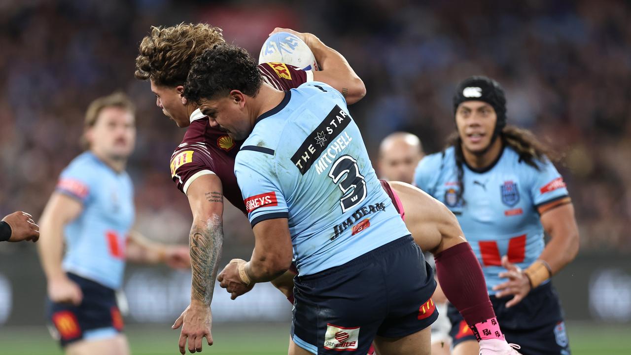 Reece Walsh monstered by Latrell Mitchell. Photo by Cameron Spencer/Getty Images.