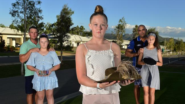 Ika Ryan, 13 with Jai Ryan, Emily Ryan, 14 and Amelia Biddle-Moro, 12 with Noel Biddle. A Mount Louisa street will have its own Anzac Day service, complete with march, under COVID-19 restrictions. PICTURE: MATT TAYLOR.