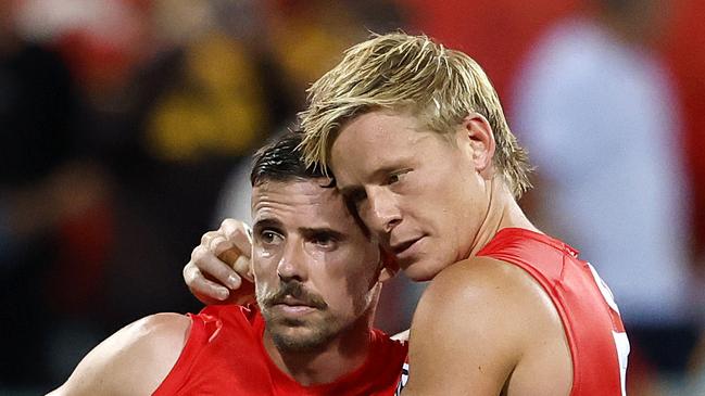 Jake Lloyd in game 250 is consoled by Isaac Heeney after the loss in the AFL Opening Round match between the Sydney Swans and Hawthorn Hawks at the SCG on March 7, 2025. Photo by Phil Hillyard (Image Supplied for Editorial Use only - **NO ON SALES** - Â©Phil Hillyard )