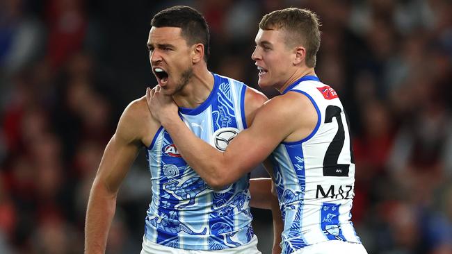 MELBOURNE, AUSTRALIA - MAY 19: Luke Davies-Uniacke of the Kangaroos celebrates kicking a goal during the round 10 AFL match between Essendon Bombers and North Melbourne Kangaroos at Marvel Stadium, on May 19, 2024, in Melbourne, Australia. (Photo by Quinn Rooney/Getty Images)