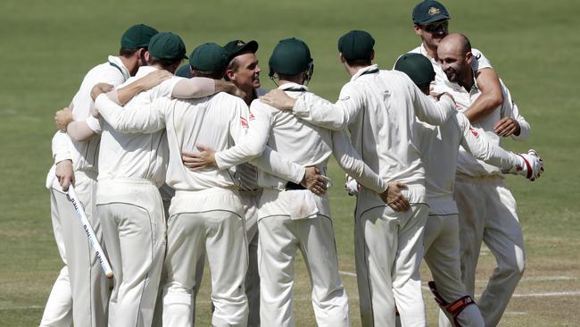 Australia's Steve O'Keefe and teammates celebrate the first Test win.