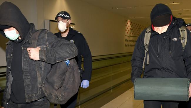 Four stowaways who attempted to enter Adelaide on a train were escorted by police at Adelaide Airport. Naomi Jellicoe/ NCA NewsWire