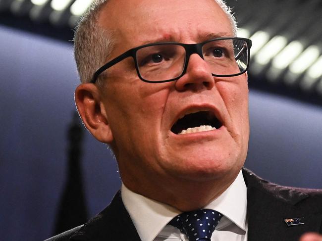 Australia's former prime minister Scott Morrison speaks to media during a press conference in Sydney on August 17, 2022. - Australia's Prime Minister Anthony Albanese on August 16 said that his predecessor Scott Morrison secretly seized control of five ministerial posts, labelling it an "unprecedented trashing of our democracy". (Photo by Steven Saphore / AFP)