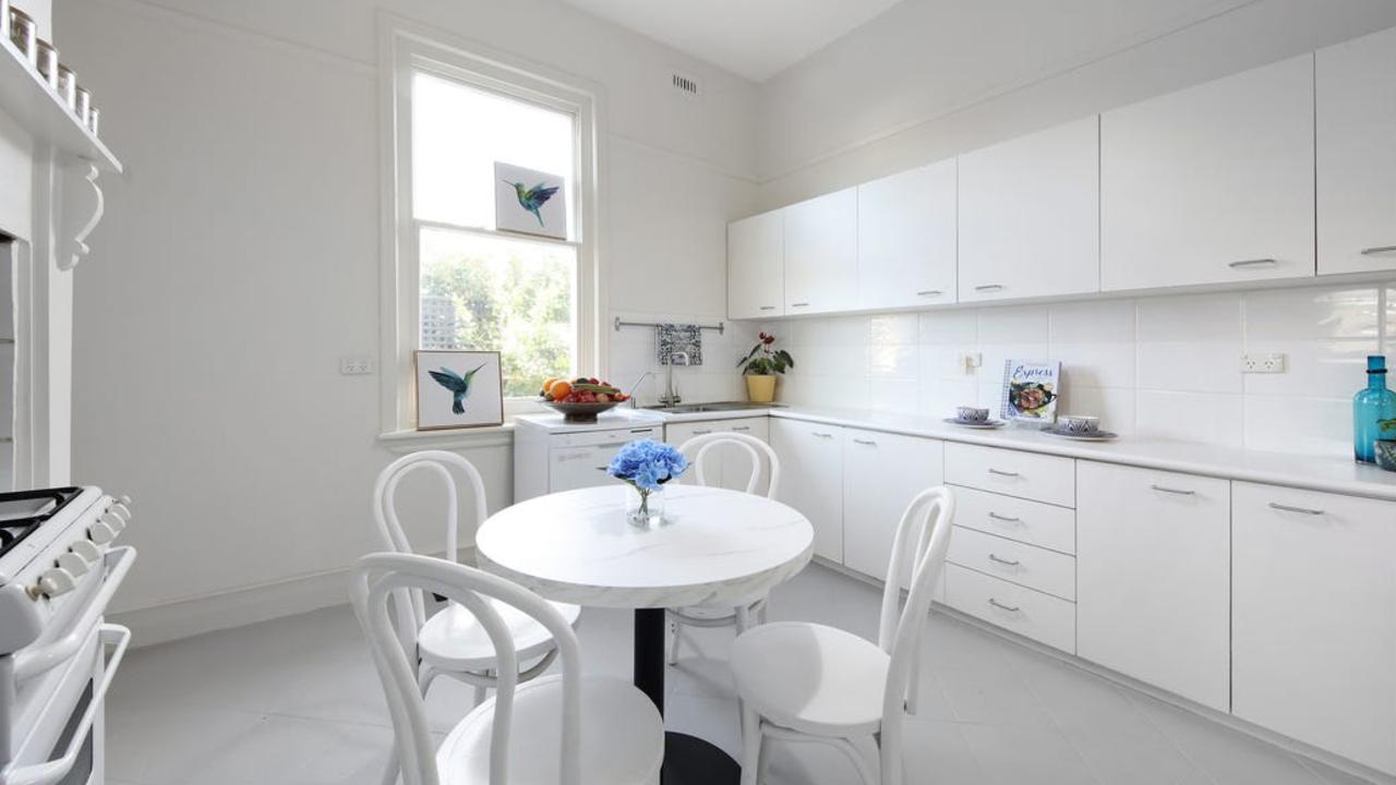 The formal dining room connects to the kitchen.